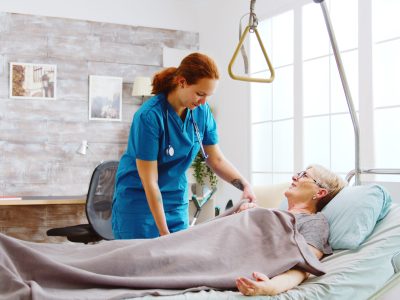 A nurse is caring for an elderly patient.